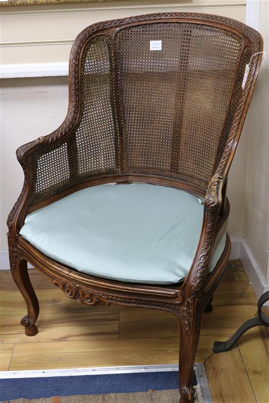 A French caned beech armchair